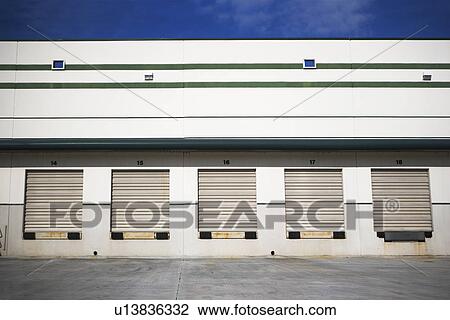 Row of closed loading docks View Large Photo Image Stock Image - Row of closed loading docks. Fotosearch