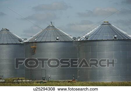 Row of grain storage silos View Large Photo Image Stock Photo - Row of grain storage silos. Fotosearch