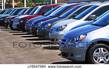 Row of new cars on lot View Large Photo Image Picture - Row of new cars on lot. Fotosearch