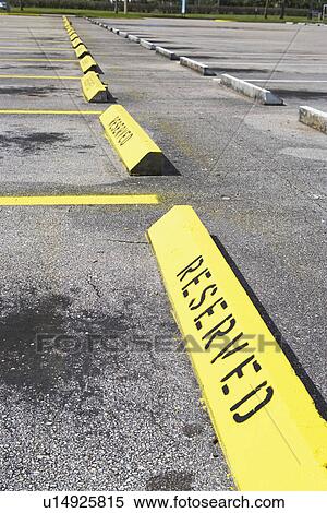Row of Reserved parking spaces View Large Photo Image Stock Photography - Row of Reserved parking spaces. Fotosearch
