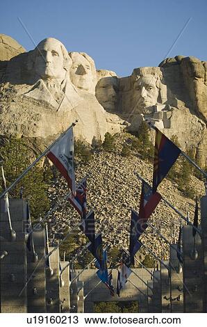 Stock Image - Rows of flags at Mount Rushmore. Fotosearch