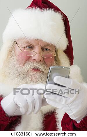 Santa Claus dialing cell phone View Large Photo Image Stock Image - Santa Claus dialing cell phone. Fotosearch