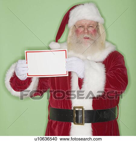 Stock Image - Santa Claus holding blank sign. Fotosearch