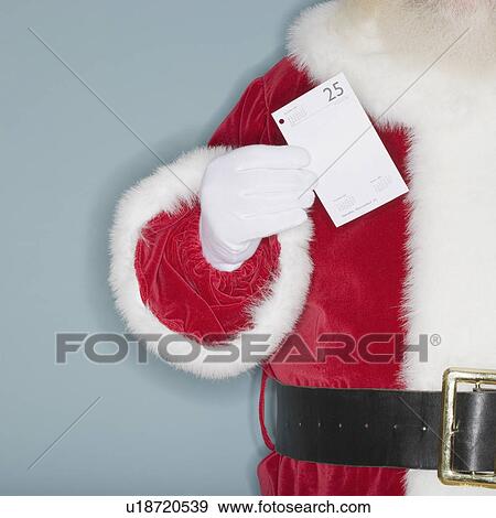 Santa Claus holding desk calendar page View Large Photo Image Stock Photo - Santa Claus holding desk calendar page. Fotosearch