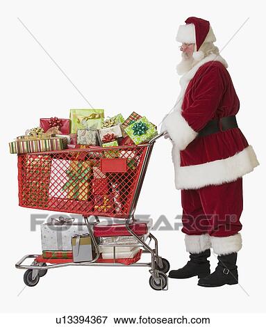 Santa Claus pushing shopping cart full of gifts View Large Photo Image Stock Photo - Santa Claus pushing shopping cart full of gifts. Fotosearch