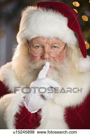 Stock Photo - Santa Claus shushing. Fotosearch