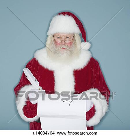 Santa Claus writing list of names View Large Photo Image Picture - Santa Claus writing list of names. Fotosearch