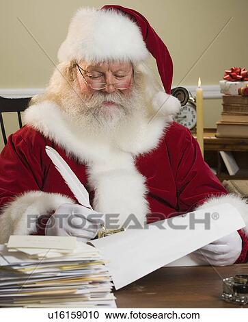Santa Claus writing list View Large Photo Image Stock Image - Santa Claus writing list. Fotosearch