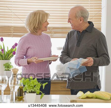 Senior couple drying dishes View Large Photo Image Stock Photo - Senior couple drying dishes. Fotosearch