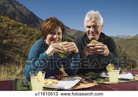 Senior couple eating outdoors, Utah, United States View Large Photo Image Stock Image - Senior couple eating outdoors, Utah, United States. Fotosearch