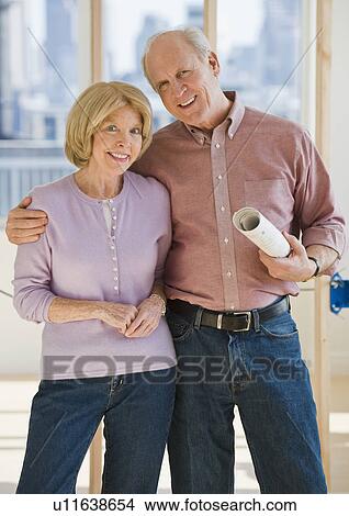 Senior couple with blueprints View Large Photo Image Picture - Senior couple with blueprints. Fotosearch