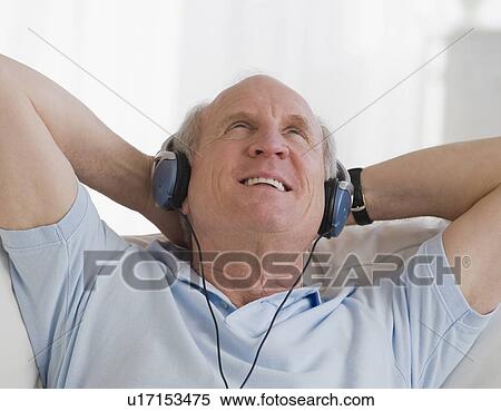 Senior man listening to headphones View Large Photo Image Stock Photography - Senior man listening to headphones. Fotosearch