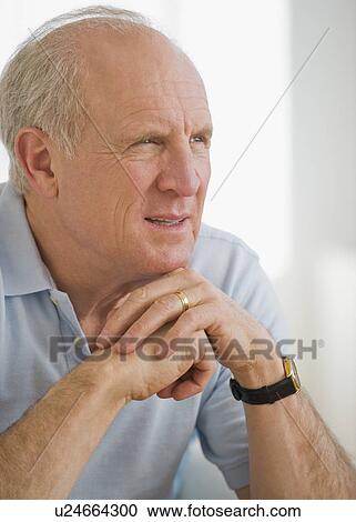 Senior man resting chin on hands View Large Photo Image Stock Image - Senior man resting chin on hands. Fotosearch