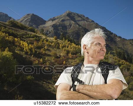 Senior man wearing backpack, Utah, United States View Large Photo Image Stock Image - Senior man wearing backpack, Utah, United States. Fotosearch