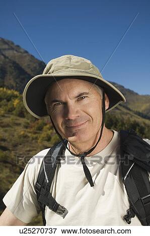 Senior man wearing backpack, Utah, United States View Large Photo Image Stock Photo - Senior man wearing backpack, Utah, United States. Fotosearch