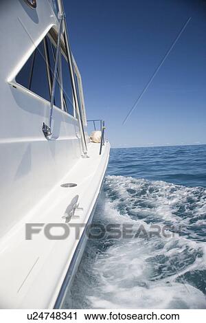 Side of a speed boat and its wake View Large Photo Image Stock Image - Side of a speed boat and its wake. Fotosearch