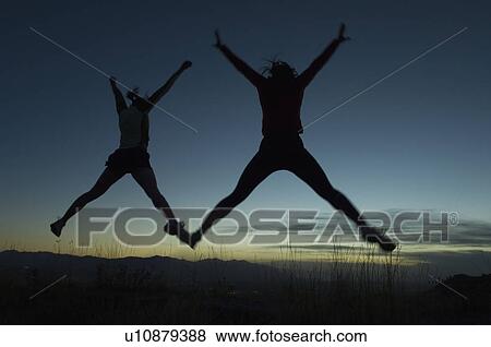 Silhouette of people jumping, Salt Flats, Utah, United States View Large Photo Image Stock Photo - Silhouette of people jumping, Salt Flats, Utah, United States. Fotosearch