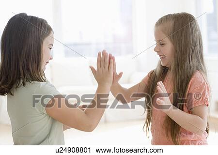 Sisters playing paddy cake View Large Photo Image Stock Image - Sisters playing paddy cake. Fotosearch