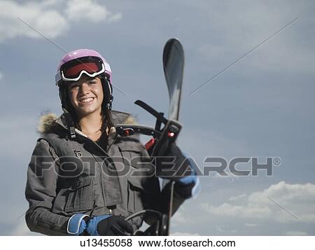 Snowboarder holding board View Large Photo Image Stock Photo - Snowboarder holding board. Fotosearch