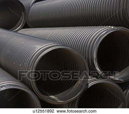 Stack of large metal pipes View Large Photo Image Stock Image - Stack of large metal pipes. Fotosearch