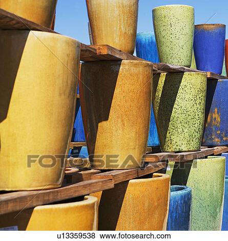 Stacks of glazed pottery vases View Large Photo Image Stock Photo - Stacks of glazed pottery vases. Fotosearch