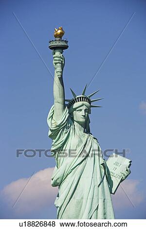 Stock Photo - Statue of Liberty under blue sky. Fotosearch