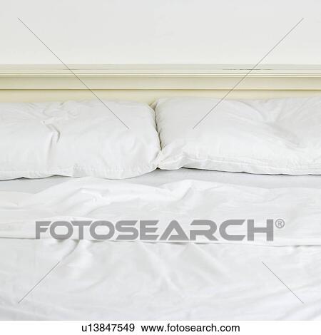 Still life of an unmade bed View Large Photo Image Stock Photo - Still life of an unmade bed. Fotosearch