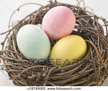 Stock Image - Still life of Easter eggs in a nest. Fotosearch