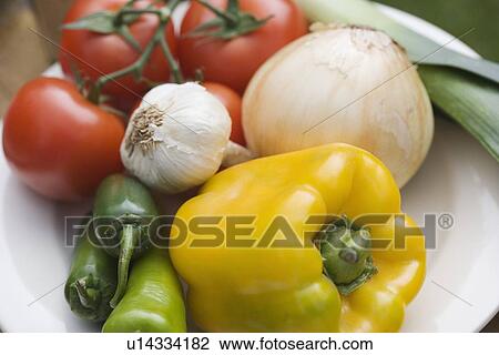 Stock Image - Still life of plate of vegetables. Fotosearch