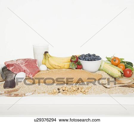 Picture - Studio shot of the four food groups. Fotosearch