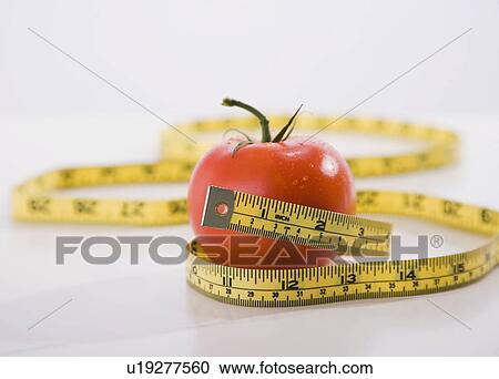 Tape measure wrapped around apple View Large Photo Image Stock Image - Tape measure wrapped around apple. Fotosearch