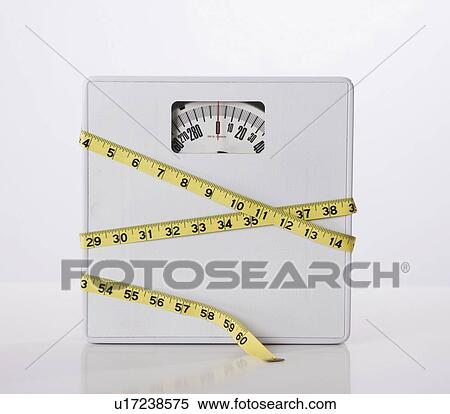 Tape measure wrapped around scale View Large Photo Image Stock Photography - Tape measure wrapped around scale. Fotosearch