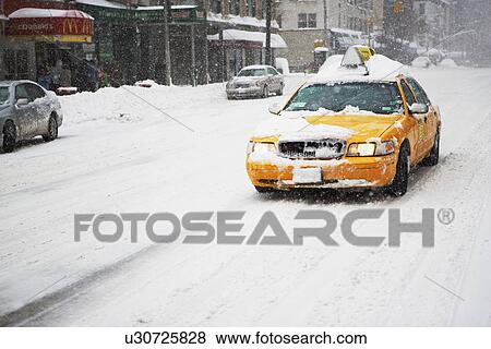 Taxi cab in snow, New York City View Large Photo Image Stock Photo - Taxi cab in snow, New York City. Fotosearch