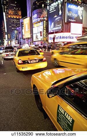 Taxi cab in Times Square, New York City View Large Photo Image Stock Image - Taxi cab in Times Square, New York City. Fotosearch