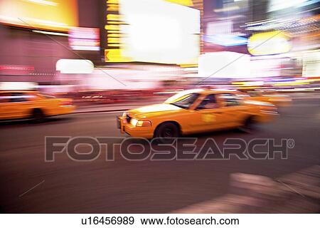Stock Photo - Taxi cab in Times Square, New York City. Fotosearch