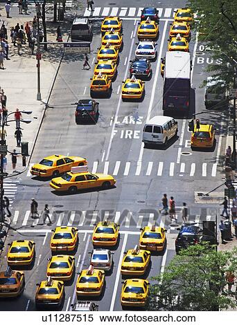 Stock Photography - Taxis on 5th Avenue, New York City. Fotosearch