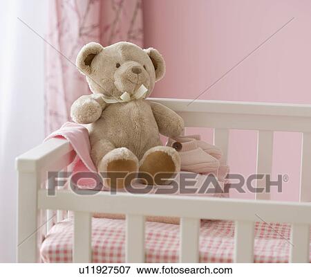 Teddy bear in crib View Large Photo Image Stock Photo - Teddy bear in crib. Fotosearch
