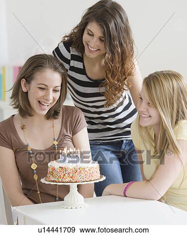 Teenage girl celebrating birthday with friends View Large Photo Image Stock Photo - Teenage girl celebrating birthday with friends. Fotosearch
