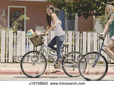 Teens riding bikes View Large Photo Image Stock Image - Teens riding bikes. Fotosearch