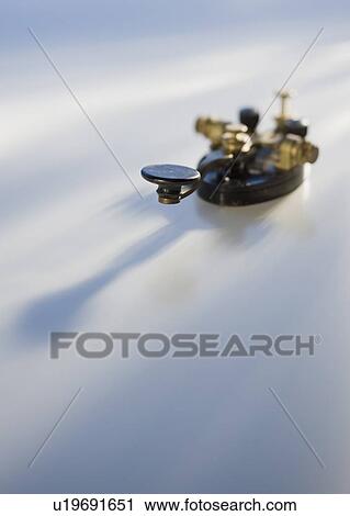Stock Image - Telegraph key on table. Fotosearch