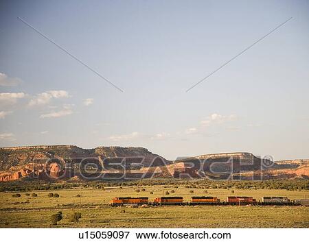 Train passing through New Mexico USA View Large Photo Image Stock Photo - Train passing through New Mexico USA. Fotosearch