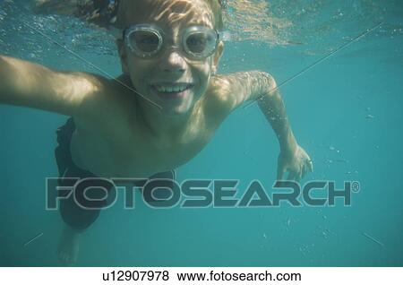 Underwater shot of boy swimming, Utah, United States View Large Photo Image Stock Photo - Underwater shot of boy swimming, Utah, United States. Fotosearch