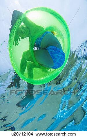 Underwater shot of child in inner tube, Florida, United States View Large Photo Image Picture - Underwater shot of child in inner tube, Florida, United States. Fotosearch