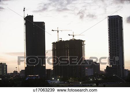 Urban construction scene at sunset View Large Photo Image Stock Photo - Urban construction scene at sunset. Fotosearch