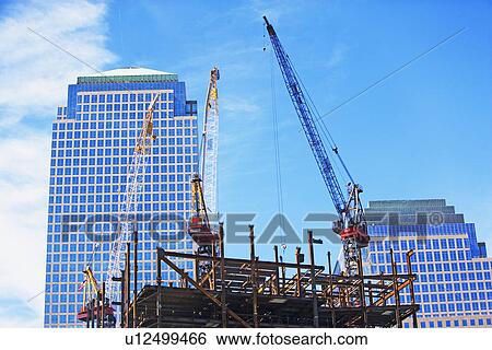 Stock Photograph - Urban construction site with cranes. Fotosearch