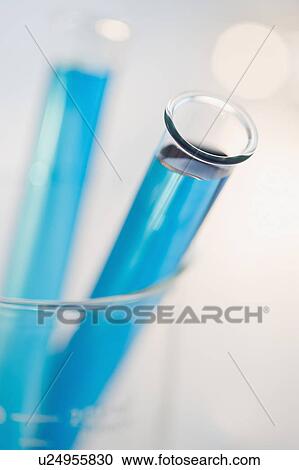 Vials of liquid in beaker View Large Photo Image Stock Image - Vials of liquid in beaker. Fotosearch