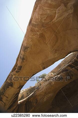 Stock Image - View through rock formation to sky. Fotosearch