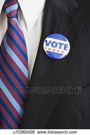 Vote pin on man’s lapel View Large Photo Image Stock Photo - Vote pin on man’s lapel. Fotosearch