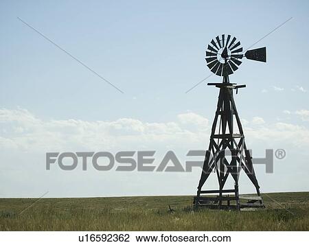 Windmill in field View Large Photo Image Stock Image - Windmill in field. Fotosearch