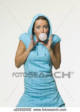 Woman blowing bubble with gum View Large Photo Image Stock Image - Woman blowing bubble with gum. Fotosearch